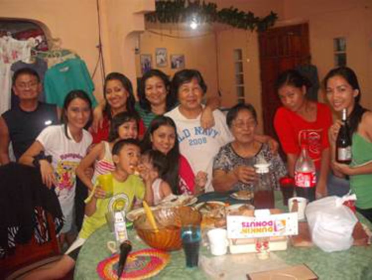 Maribel Barton, back row, third from left, poses with family and friends during a a visit she took with her parents to the Philippines in January.