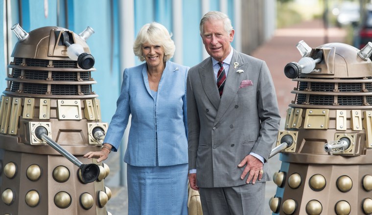 CARDIFF, WALES - JULY 03:  Prince Charles, Prince of Wales and Camilla, Duchess of Cornwall are greeted by two Daleks from the Dr Who TV series as the...