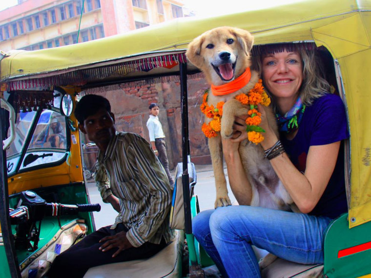 Image: Joanne Lefson with Rupee the dog in a tuk tuk.