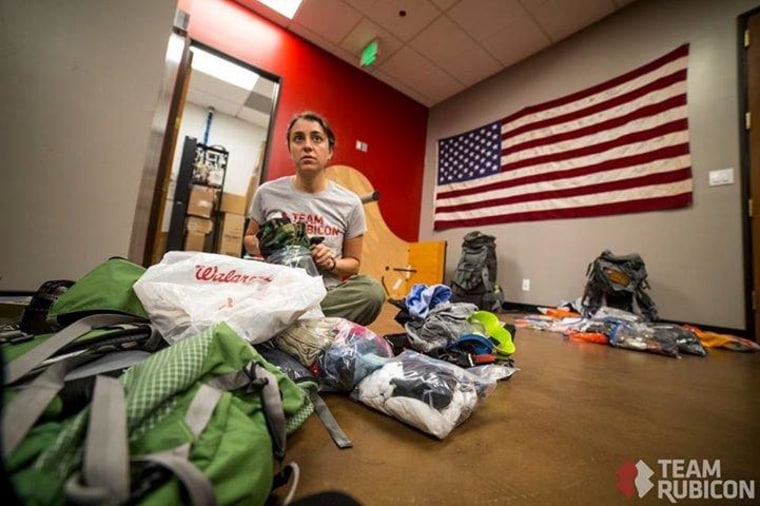 Army veteran Elana Duffy, who served in both Afghanistan and Iraq, packs 85 pounds of gear, including medical kits, before shipping off to the Philippines to render aid.