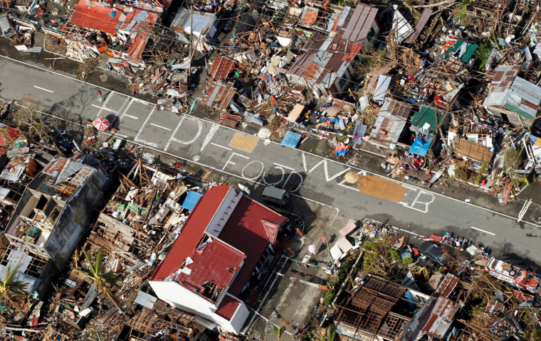 Signs for help can be seen from the air in the coastal town of Tanawan, central Philippines, Nov. 13, 2013.