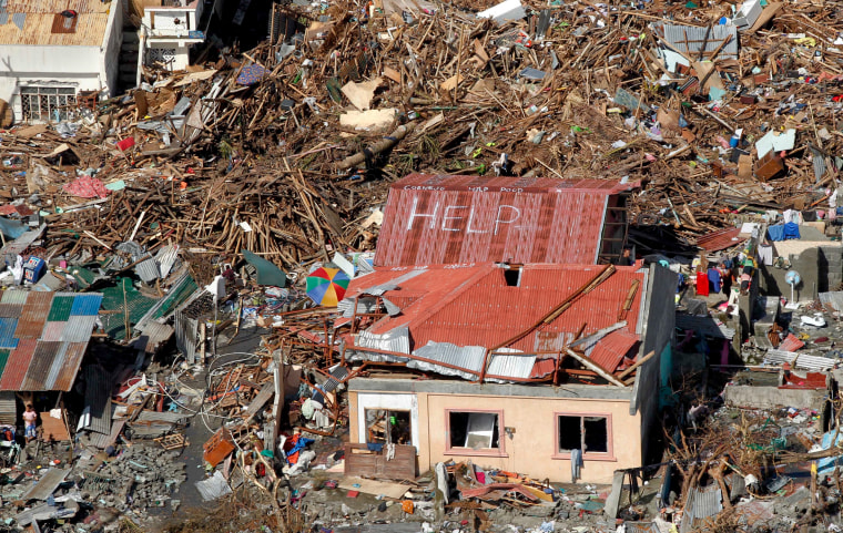 A roof is turned into a sign for help amid the destruction in Tanawan, central Philippines, Nov. 13, 2013.