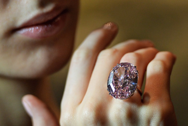 epa03948242 (FILE) A file picture dated 24 October 2013 shows a model wearing the Pink Star diamond at Sotheby's auction house in London, Britain. The...