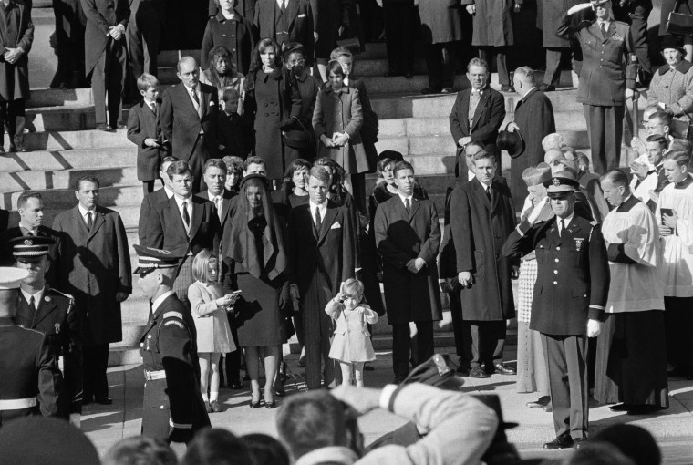 25 Nov 1963, Washington, DC, USA --- Original caption: Like a little soldier, John F. Kennedy Jr. who celebrates his 3rd birthday, salutes at the cask...
