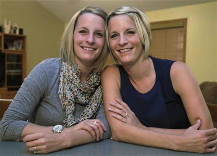 This Monday, Nov. 11, 2013,photo shows identical twins Kristen Maurer, left, and Kelly McCarthy.
