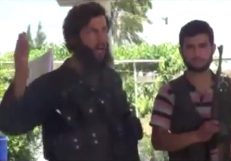 Islamist Syria fighter Mohammed Fares (L), seen here in a YouTube video, who was later beheaded by a fellow fighter by mistake.
