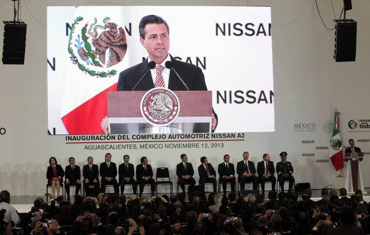 Mexico's President Enrique Pena Nieto, right, speaks during the opening of Nissan's new plant in Aguascalientes, Mexico, on Nov. 12, 2013.