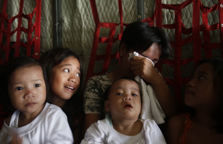 Typhoon survivors wait days for mercy flights out of Tacloban