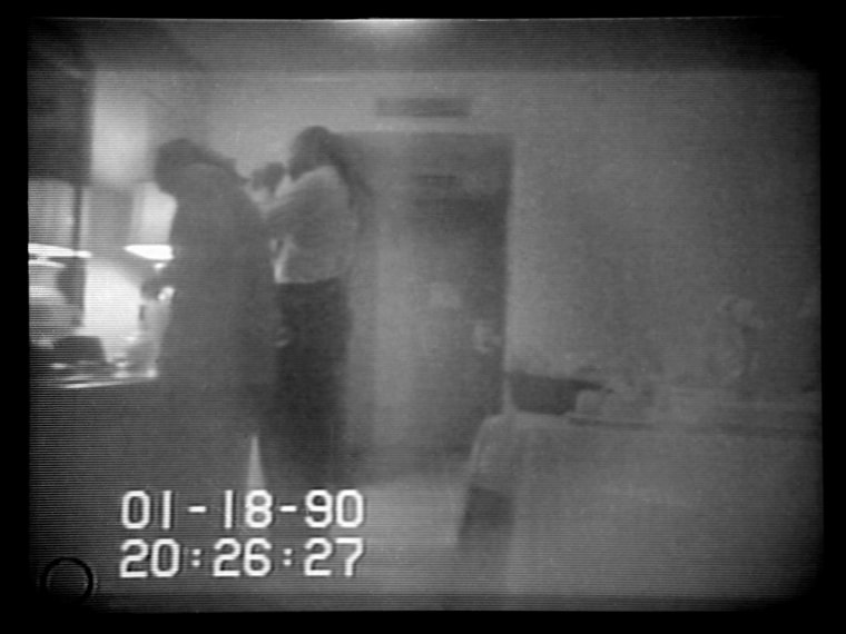 This frame from an FBI videotape shows Marion Barry allegedly lighting a crack cocaine pipe in a Washington hotel on January 18, 1990.