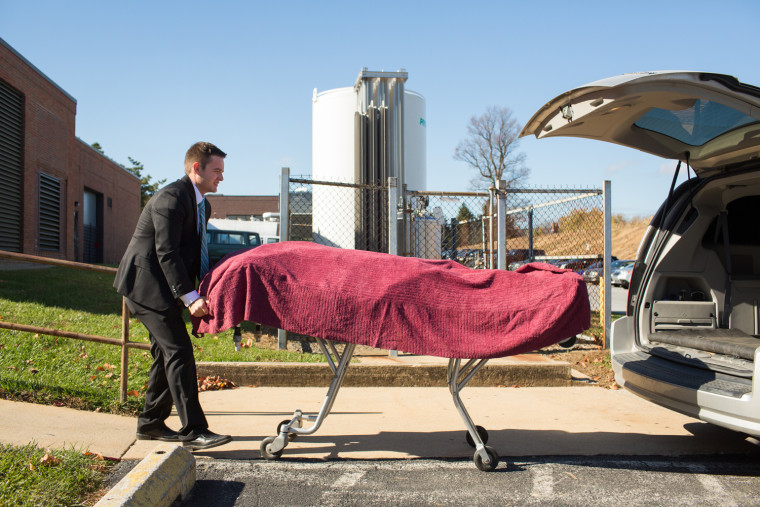 Funeral director Caleb Wilde picks up a deceased person from Brandywine Hospital in Coatesville, Penn.