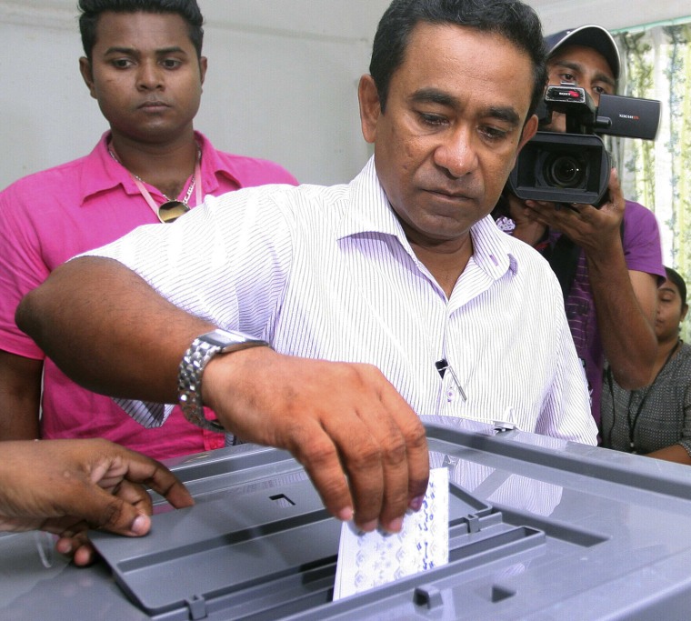 Progressive Party of Maldives (PPM) presidential candidate Abdulla Yameen casts his vote at a polling station in Male on Nov. 9.