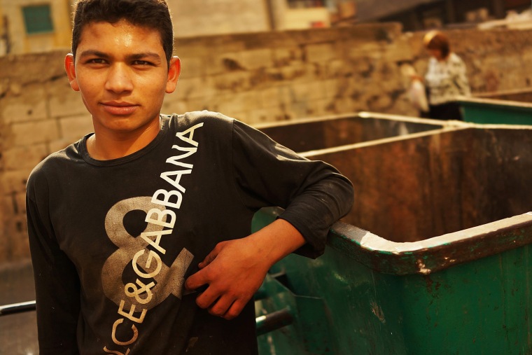 Saad, a teen from Raqqa, Syria, collects scrap metal to sell.