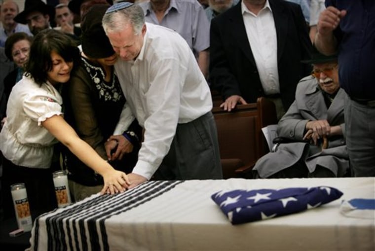 Daniel Wultz's sister, mother and father touch his coffin during a May 15, 2006, memorial service in Jerusalem before his body was transferred to the U.S. for burial.