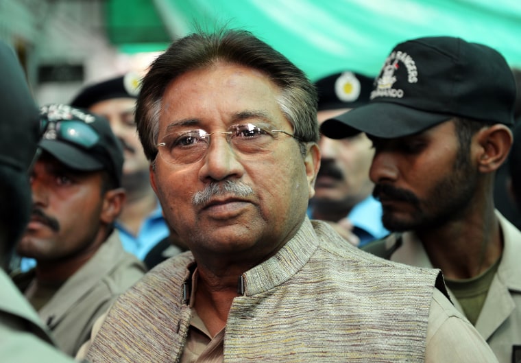 In this photograph taken on April 20, 2013, former Pakistani president Pervez Musharraf is escorted by soldiers as he arrives at an anti-terrorism court in Islamabad. A Pakistan court on Nov. 4, 2013, granted bail to former military ruler Pervez Musharraf over a deadly raid on a radical mosque, but on Sunday Interior Minister Chaudry Nisar said the government would try Musharraf for high treason.