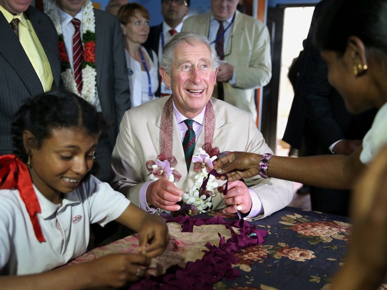NUWARA ELIYA, SRI LANKA - NOVEMBER 16:  Prince Charles, Prince of Wales takes part in arts and crafts with disabled children as he visits MEDCAFEP Day...