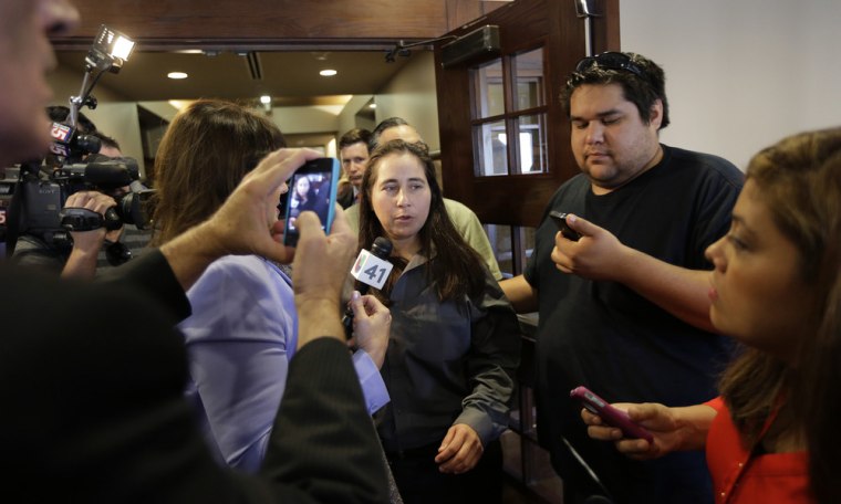 Anna Vasquez, center, leaves a courtroom at the Bexar County Courthouse in San Antonio on Monday, Nov. 18, after it was announced that three of four women imprisoned for sexually assaulting two girls in 1994 were expected to walk free after a judge agreed that their convictions were tainted by faulty witness testimony. Vasquez, the fourth woman, has already been paroled.