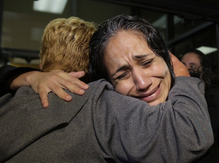 Cassandra Rivera, right, is greeted by family members after she, Elizabeth Ramirez and Kristie Mayhugh were released from the Bexar County Jail, on Monday night, in San Antonio.