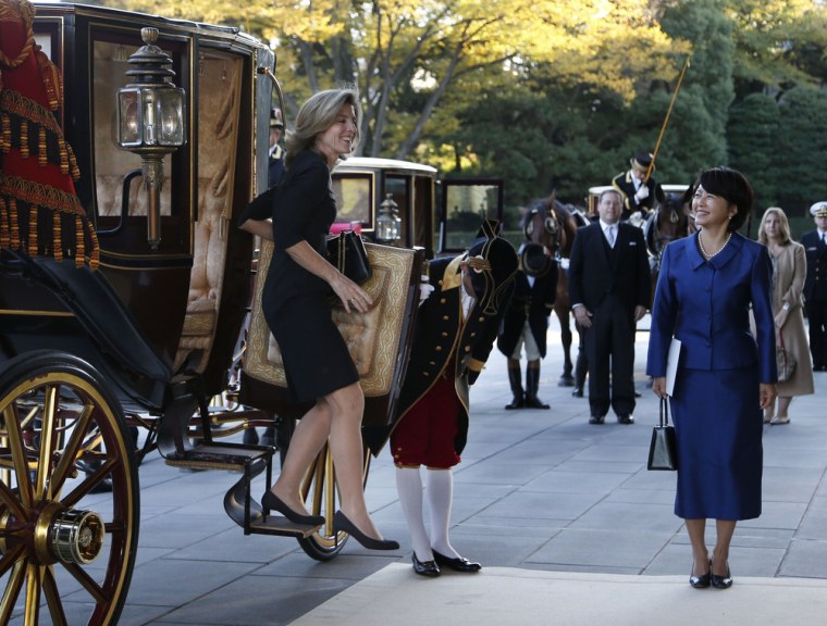 U.S. Ambassador to Japan Caroline Kennedy smiles as she steps out from a horse-drawn imperial carriage upon her arrival at the Imperial Palace in Tokyo on Tuesday.