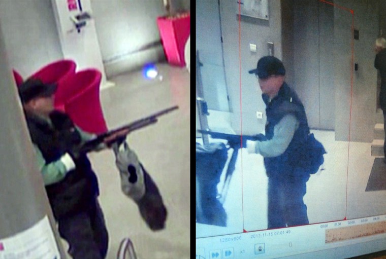 Surveillance camera images show the gunman at the headquarters of a Paris TV station on Friday.