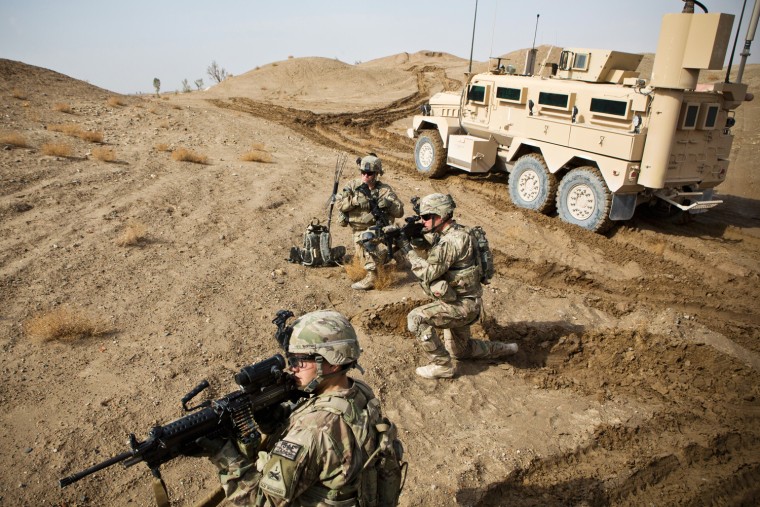 U.S. Army soldiers with Charlie Company, 36th Infantry Regiment, 1st Armored Division set up a supportive position during a mission near Command Outpost Pa'in Kalay in Maiwand District, Kandahar Province in February.