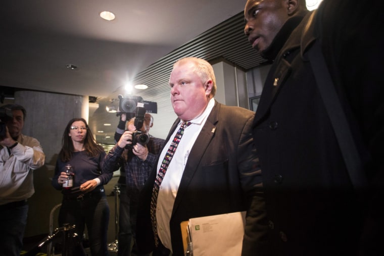 Mayor Rob Ford arrives at city hall in Toronto on Tuesday, Nov. 19, 2013. Ford vowed