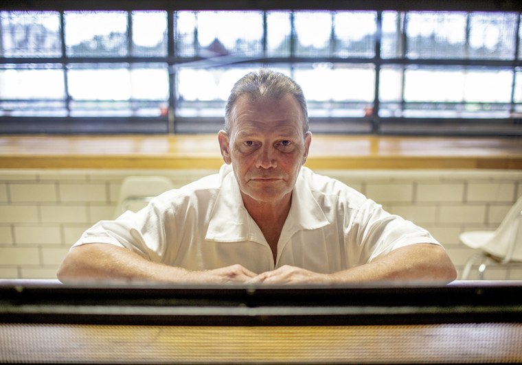 Douglas Boyington sits behind a plexiglass window in the Goree Unit of the Texas State Penitentiary in Huntsville, Texas, on Oct. 15, 2013. Boyington is currently serving a 75-year prison sentence in connection to a 1988 fire at a Pasadena, Texas, apartment building.