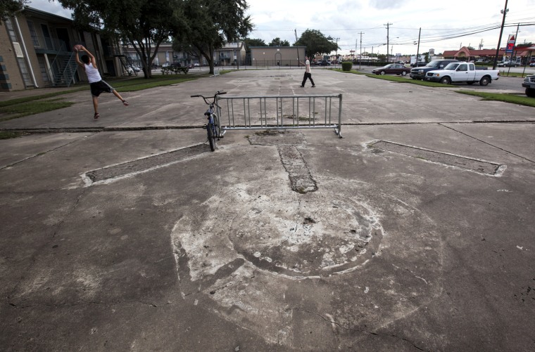 On the site of a Pasadena, Texas, apartment building that burned in 1988, charred outlines of where the walls once stood are still evident on a concrete slab. Douglas Boyington was convicted of setting the fire and sentenced to 75 years in prison.