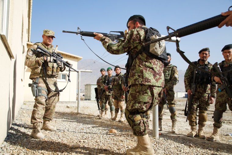 Tech. Sgt. Rafael Melendez (left) of the 439th Air Expeditionary Advisory Squadron training Afghan forces on close quarters combat Wednesday at an Afghan Air Force base in Kabul, Afghanistan.
