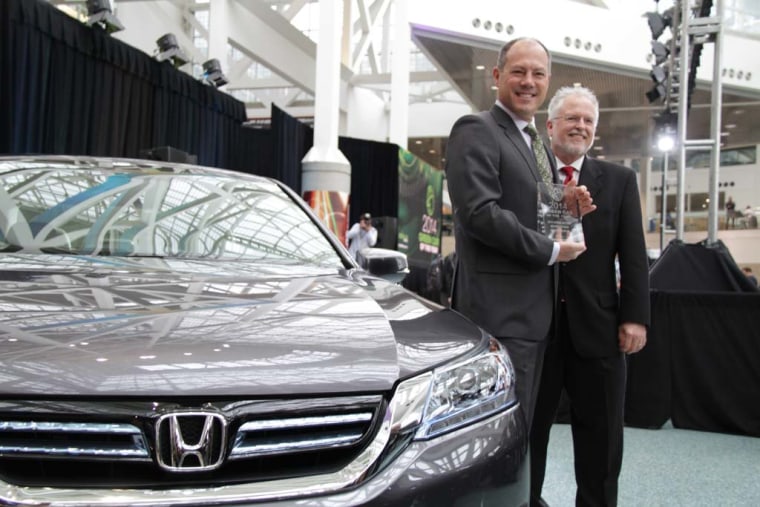 Mike Accavitti, marketing chief for American Honda, left, and Ron Cogan, publisher of Green Car Journal, with a 2014 Honda Accord, the Green Car of the Year.