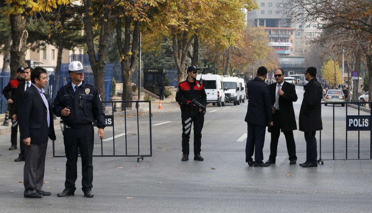 Turkish police take security measures on a road leading to Prime Minister Tayyip Erdogan's offices in Ankara after a man tried to enter the building with a fake bomb on Thursday.