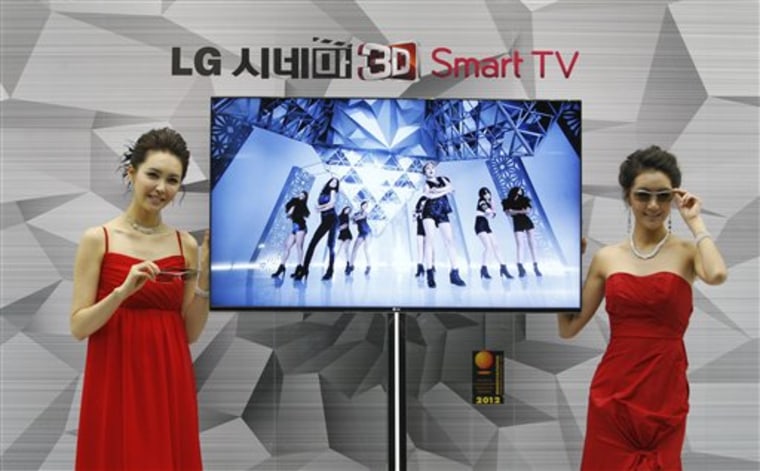 South Korean models pose with a CINEMA 3D Smart TV