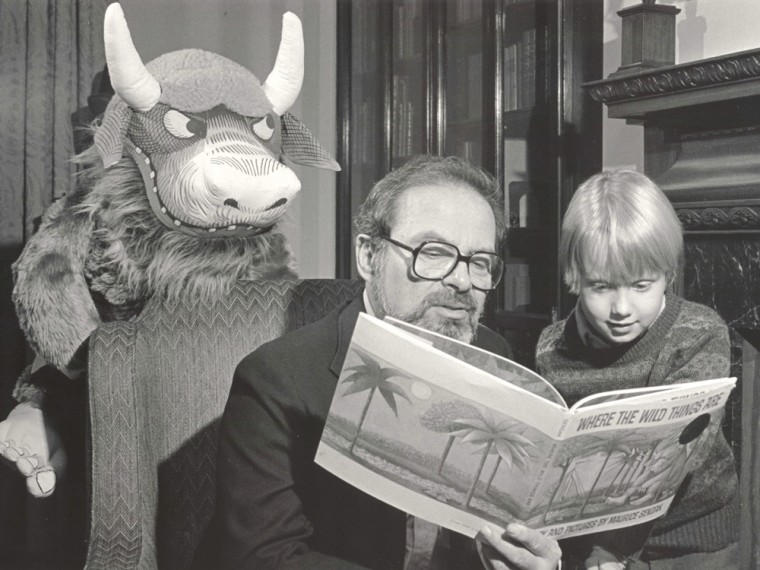 Author Maurice Sendak reads his signature work with a young fan at the Rosenbach Library and Museum in Philadelphia, Pennsylvania in 1985.