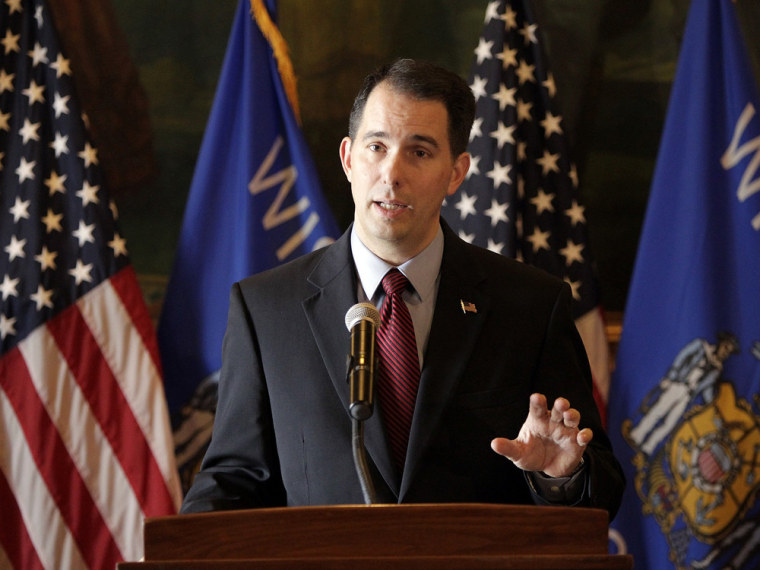 Wisconsin Gov. Scott Walker talks about his call for a special session of the Legislature to delay shifting more than 100,000 Wisconsinites to the federal health insurance exchange, during a press conference at the state Capitol in Madison, Wis., Thursday, Nov. 14, 2013.