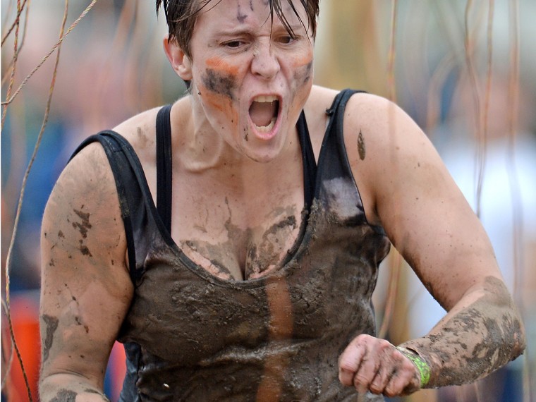 Participants take part in the Tough Mudder endurance event at Dalkieth Country Estate on August 24, 2013, in Edinburgh, Scotland.