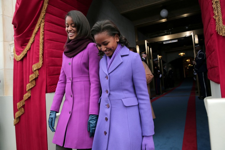 WASHINGTON, DC - JANUARY 21:  (L-R) Malia Obama and Sasha Obama arrive during the presidential inauguration on the West Front of the U.S. Capitol Janu...