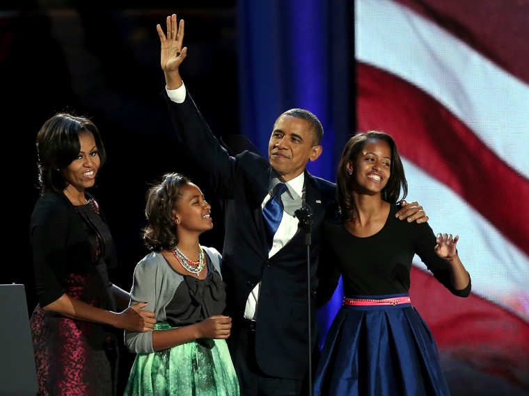 CHICAGO, IL - NOVEMBER 06:  U.S. President Barack Obama walks on stage with first lady Michelle Obama and daughters Sasha and Malia to deliver his vic...