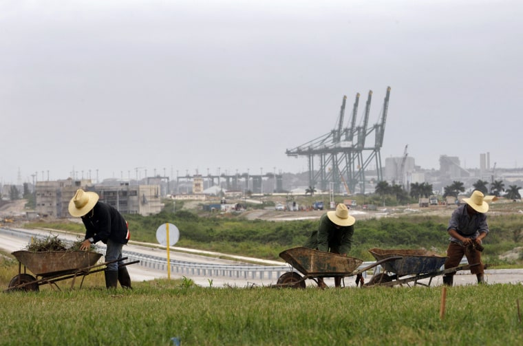 Workers landscape the area near a new port under construction in Mariel, Cuba, in November,