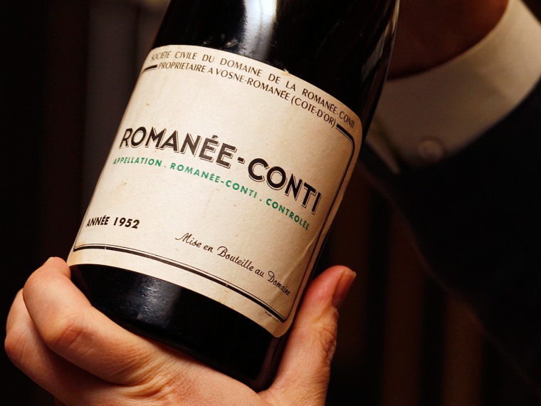 A Domaine Romanee Conti (DRC) wine bottle from 1952 is shown as part of a super lot of 55 bottles of every vintage of DRC released between 1952 and 20...
