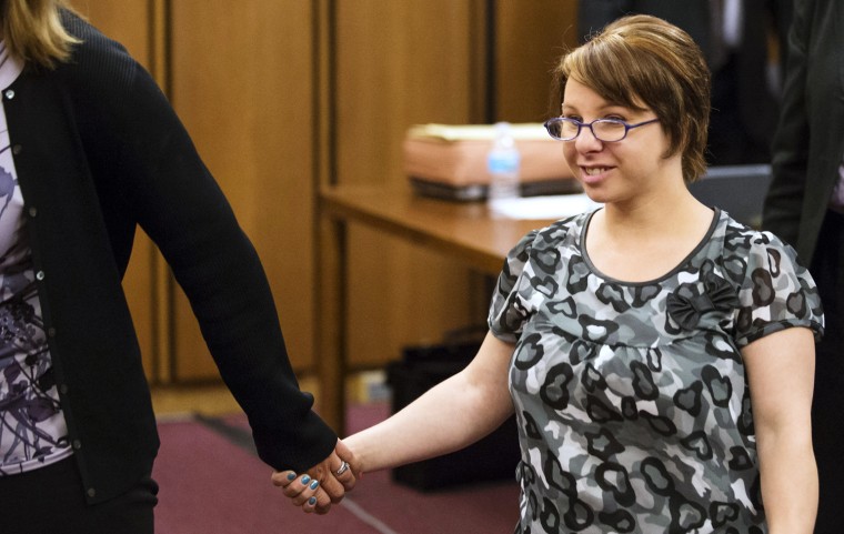 CLEVELAND, OH - AUGUST 1: Michelle Knight leaves the courtroom after Ariel Castro was sentenced to life in prison without parole plus one thousand years for abducting three women on August 1, 2013 in Cleveland, Ohio. Knight, abducted by Castro in 2002, addressed the court during the sentencing, telling Castro,