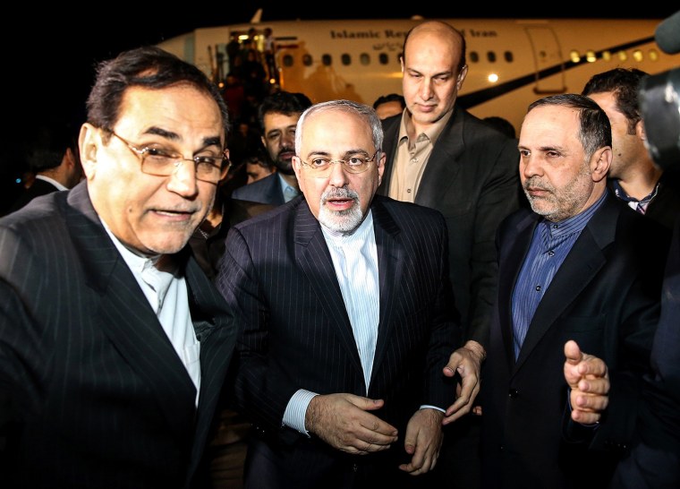 Iranian Foreign Minister Mohammad Javad Zarif, center, arrives at the Tehran airport after the deal.