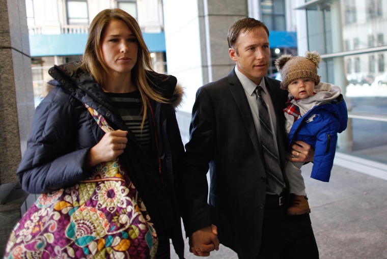 Olympic alpine skier Bode Miller arrives with his wife Morgan and his 9-month-old son at Manhattan's Family Court in New York, on Nov. 25.