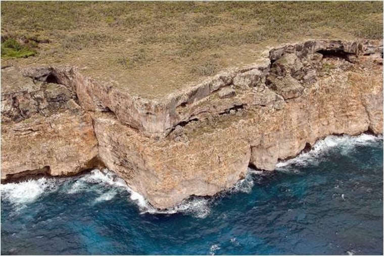 A rocky outcropping on the shoreline of Mona Island. Smugglers often shove their human cargo overboard and order them to swim to the island - which is very dangerous in rough seas. Migrants often drown trying to reach the rocky shore.