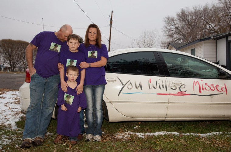 Tom and Evie Lesser and their sons wear shirts in honor of their son Tommy Clark, who was killed by a texting driver.