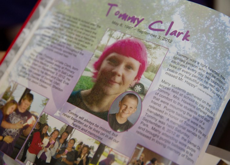 Evie Lesser shows a yearbook spread dedicated to her son, Tommy Clark, who was killed by a texting driver.