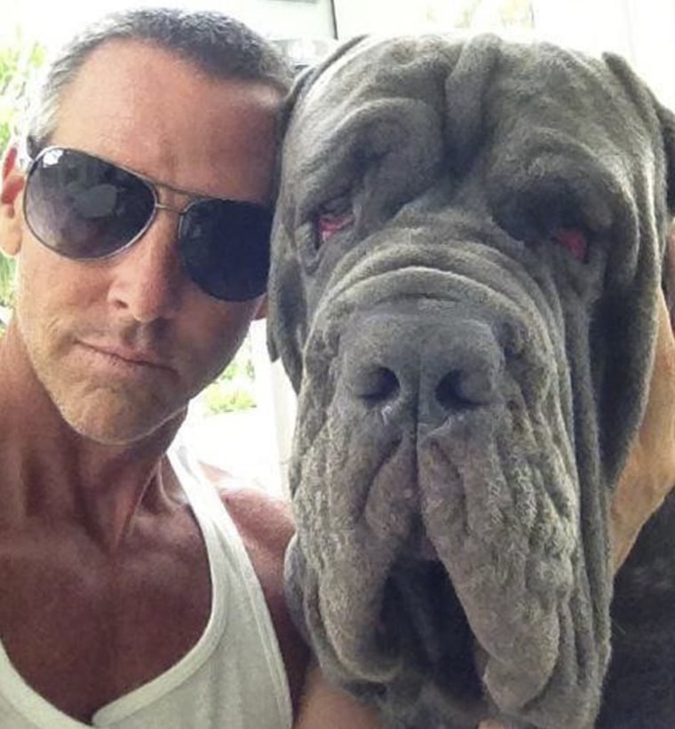 Michael Jarboe and his mastiff, BamBam, are pictured in this undated handout photo. In 2012, BamBam was found dead on arrival in San Francisco by baggage handlers following a flight layover in Houston in 90-degree heat.