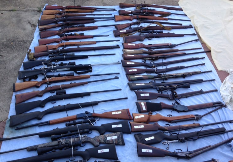 A selection of the firearms from a huge stockpile of 328 guns and 4.2 tons of ammo recovered by police in Queensland, Australia.