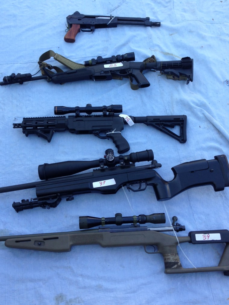 A selection of the firearms from a huge stockpile of 328 guns and 4.2 tons of ammo recovered by police in Queensland, Australia.