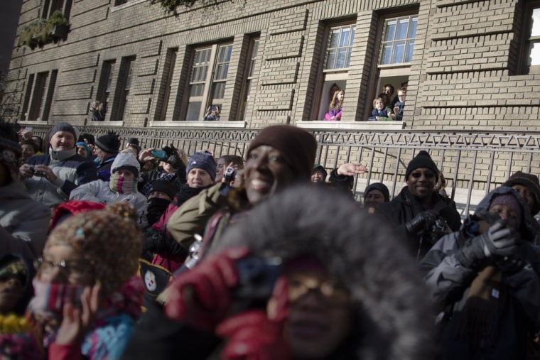 Children watch as the parade passes along Central Park West.