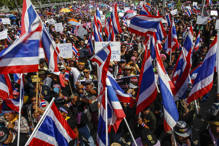 Thousands of anti-government protesters gather as they march toward to Department of Special Investigation (DSI) in Bangkok November 30, 2013. Police tightened security in Thailand's capital on Saturday as thousands of protesters rallied outside a state telecommunications group and vowed to occupy Prime Minister Yingluck Shinawatra's office to paralyse her administration.