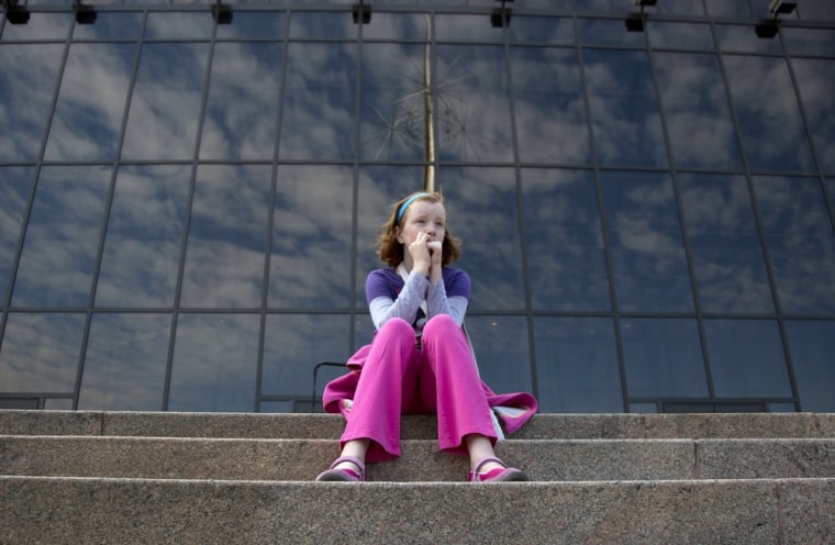 Fay Wagstaff of El Paso, Texas, sits on the front steps of the closed Smithsonian National Air and Space Museum in Washington, Oct. 1.